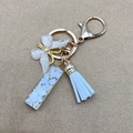 Golden butterfly keychain with white tassel and seashell resin pendant variant - Letter I