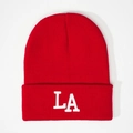 Classic red knitted beanie with white LA logo embroidery for a trendy street style look - Red