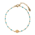 Detail of gold stainless steel bracelet with teal beads and sunburst charm - Light Blue