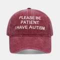 Close-up of white embroidery text on a washed burgundy vintage cotton baseball cap - Adjustable / Burgundy