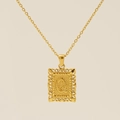 Golden necklace with square cutout pendant featuring letter Q and ornate floral texture - Letter Q