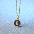 Golden round pendant necklace with black enamel inlay featuring letter Q detail - Letter Q