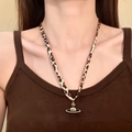 Chic leopard print fabric necklace with gold planet Saturn pendant on a model - Cloth Leopard Saturn Hollow (HN10352)