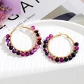 Detail of purple striped agate beads hand-wrapped on gold stainless steel hoop earrings - Black Purple Beads