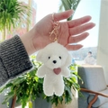 White Dog With Golden Buckle & Pink Heart