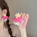 Detail of pink and cream organza flower earrings worn by a model in soft natural light - Pink and White Organza Petals with Yellow Stamen (12# Silver Earring Post - White-Pink)