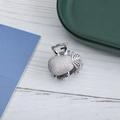 Detailed view of small silver metal hair claw clip with checkered texture and hollow design - Checkered Geometric / Silver