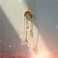 Golden crescent moon suncatcher with heart and teardrop crystals showing rainbow reflections - US 9