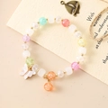 Elegant beaded crystal bracelet with white butterfly charm and golden metal spacers - Color Crackle + White Bodhi White Butterfly (K3513)