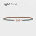 Light blue thin faux leather belt featuring a decorative pearl and rhinestone buckle - Light Blue