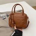 Brown woven leather handbag with matching tassels and light gold hardware accents - Brown