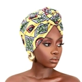 African print turban in vibrant yellow with geometric tribal patterns and gold earrings - One Size / Yellow