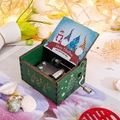 Dark green hand-cranked wooden music box with Christmas tree carvings and gnome artwork - Christmas 8/Green/Happy New Year Gnome Illustration
