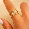 Macro view of gold minimalist double-layer wave ring with dual pearl accents on hand - Double Pearl Wavy Ring (S40)