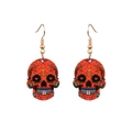 Vibrant orange skull earrings with colorful patterns and golden metal hooks on white background - Orange