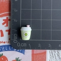 Detailed macro shot of 1.5cm miniature green juice cup resin ornament on a grid board - 5*Thickened Green Avocado Bottle