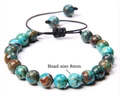Detail shot of 8mm natural tiger eye stone beads on a handmade woven adjustable bracelet - Natural Stone