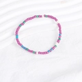 Macro view of colorful bohemian bead bracelet set with purple, green, blue and white beads - Purple Green Blue White Mix