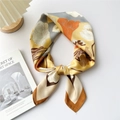Floral square silk scarf in yellow and grey, tied elegantly on a minimalist white backdrop - Camel Border White Peony