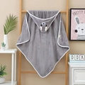 Detail of grey elephant hooded baby towel with soft coral fleece texture on a wooden ladder - Grey Bear