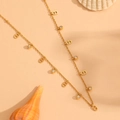 Gold titanium steel necklace with CD pendants and sparkling crystals in flat lay - Logo Style with Stone (L411)