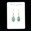 Elegant gold drop earrings with marquise-cut turquoise gemstones on a fashion card - Amazonite