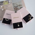 Pink drawer jewelry box with gold logo for rings, necklaces, and bracelet storage - Pink