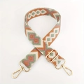 Close-up of diamond jacquard fabric strap with gold metal hooks for handbags - Green Pink Brown