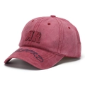 Close-up of vintage washed red cotton fabric with detailed double R embroidery on the cap - Washed Wine Red (G)