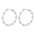 Detailed macro view of white enamel hoop earrings featuring micro-paved cubic zirconia stones - Silver White