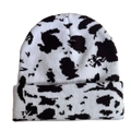 Detailed view of the soft knit texture and black and white cow print on the winter beanie - Cow Print - White & Dark Brown