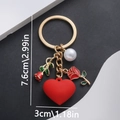 Detail view of butterfly rose keychain with size labels 7.6cm length and 3cm heart width - Red Rose Heart Pearl Style (ER687)