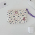 Detailed top view of a quilted floral pouch with bear pattern and a purple wrist strap - Purple Flower Toy Bear