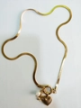 Gold herringbone chain necklace with heart pendant and pearl detail in vintage style - Letter K