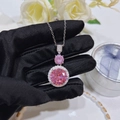 Detailed close-up of pink zircon pendant necklace with silver chain and halo setting - Pink Zirconia Necklace