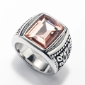 Close-up of vintage stainless steel ring with square champagne gemstone and carvings - Steel Color Pink Gemstone
