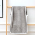 Thick grey coral fleece towel with vertical stripes and white rope edging on a wooden rack - Towel (35x75cm) / Light Gray