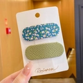 Set of two hair clips featuring blue floral fabric and green knit texture for kids - Fabric Wrapped Clip (3295) / 2 Pcs/Set / Green