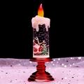 Macro detail of Christmas lantern featuring Santa scene with swirling liquid and glitter - Red Candle Santa and Tree
