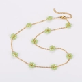 Minimalist gold chain necklace featuring multiple light green bead daisy flower charms - Fruit Green