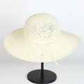 Elegant ivory wide-brim crochet straw hat with a decorative bow for beach sun protection - M (56-58cm) / 157 Milk White