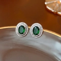 Macro shot of vintage style oval emerald green studs with double crystal halo decoration - Multi-layer Oval Style (Silver Needle Green Zirconia Multi-layer Oval Studs)