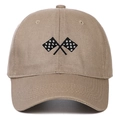 Close-up of checkered flag embroidery on a tan cotton baseball cap with fine stitching - Khaki