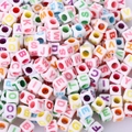 Macro shot of assorted colorful alphabet beads for creative DIY jewelry and craft making - 6x6mm White With Colored Letters (100pcs)