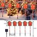 Solar Christmas Santa Stop Here path lights with candy cane stakes and red house design - Battery Box / Little House