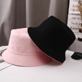 Reversible canvas bucket hat in pink and black for sun protection and casual wear - One Size / Pink
