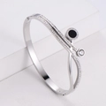 Silver stainless steel crossover bracelet with white zircons and Roman numeral disc - Steel