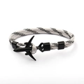 Detail shot of a black and white braided paracord bracelet with a black airplane charm - Black Airplane Buckle / Grey Black