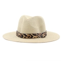 Detail of leopard print ribbon and gold metal buckle on a wide brim straw hat - Beige
