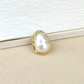Detailed macro view of a baroque freshwater pearl with a textured gold plated metal border - Baroque Pearl Gold Border